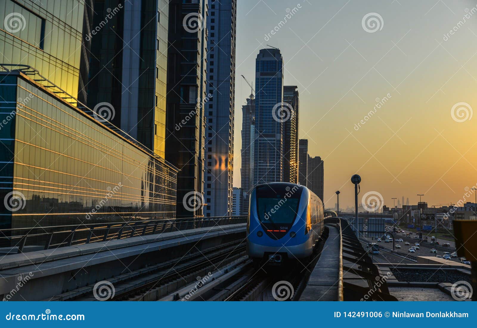 A Metro Train Running on Track at Sunset Editorial Photo Image of