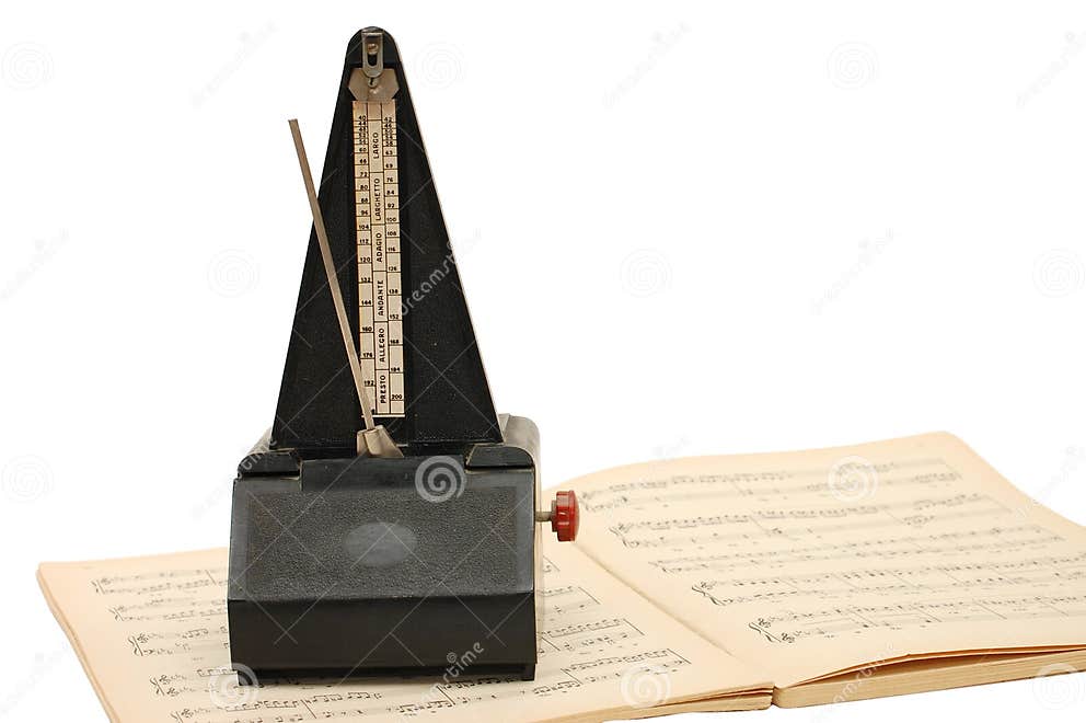 Metronome on sheet music stock image. Image of pianist 10911783