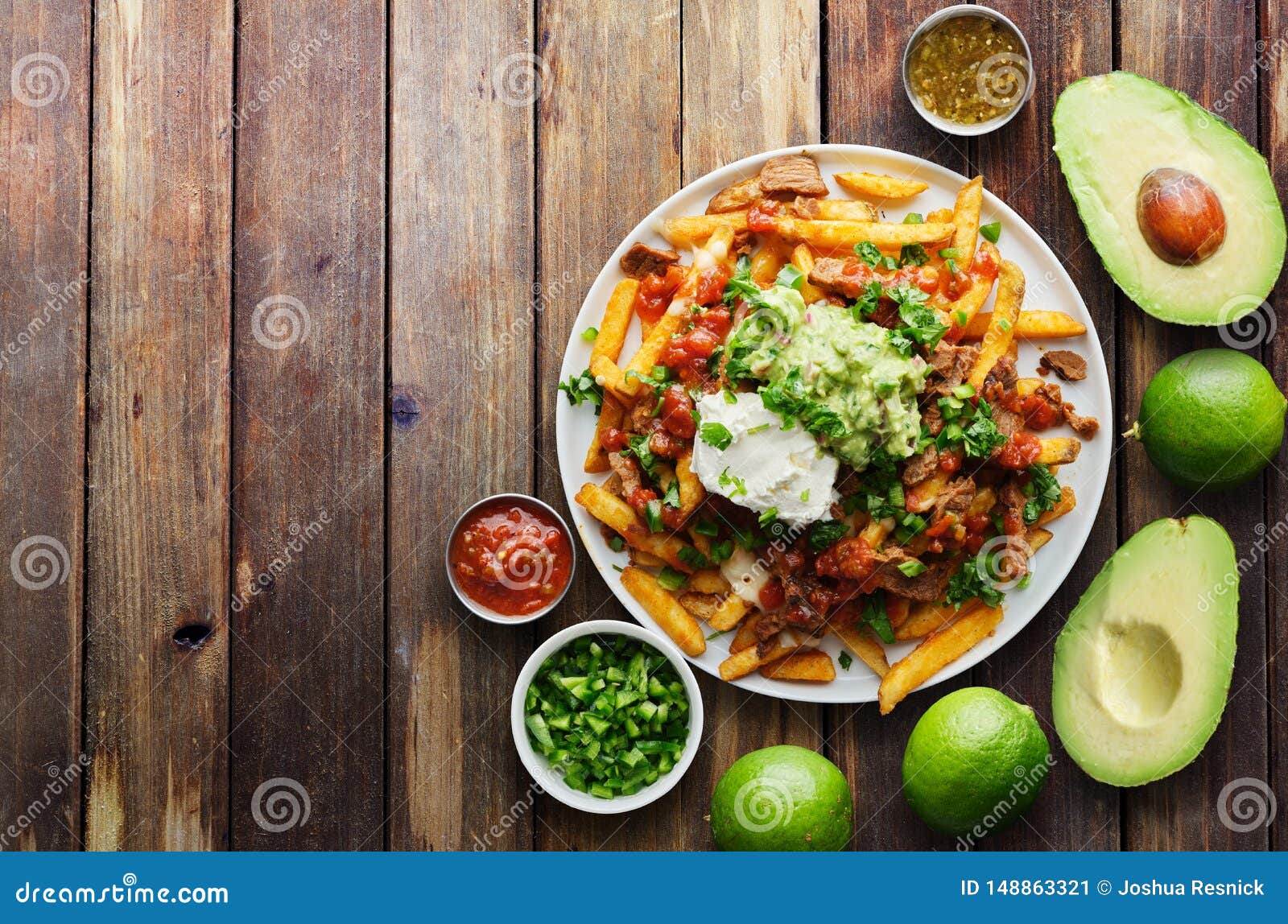 mexican carne asada fries on wooden table top