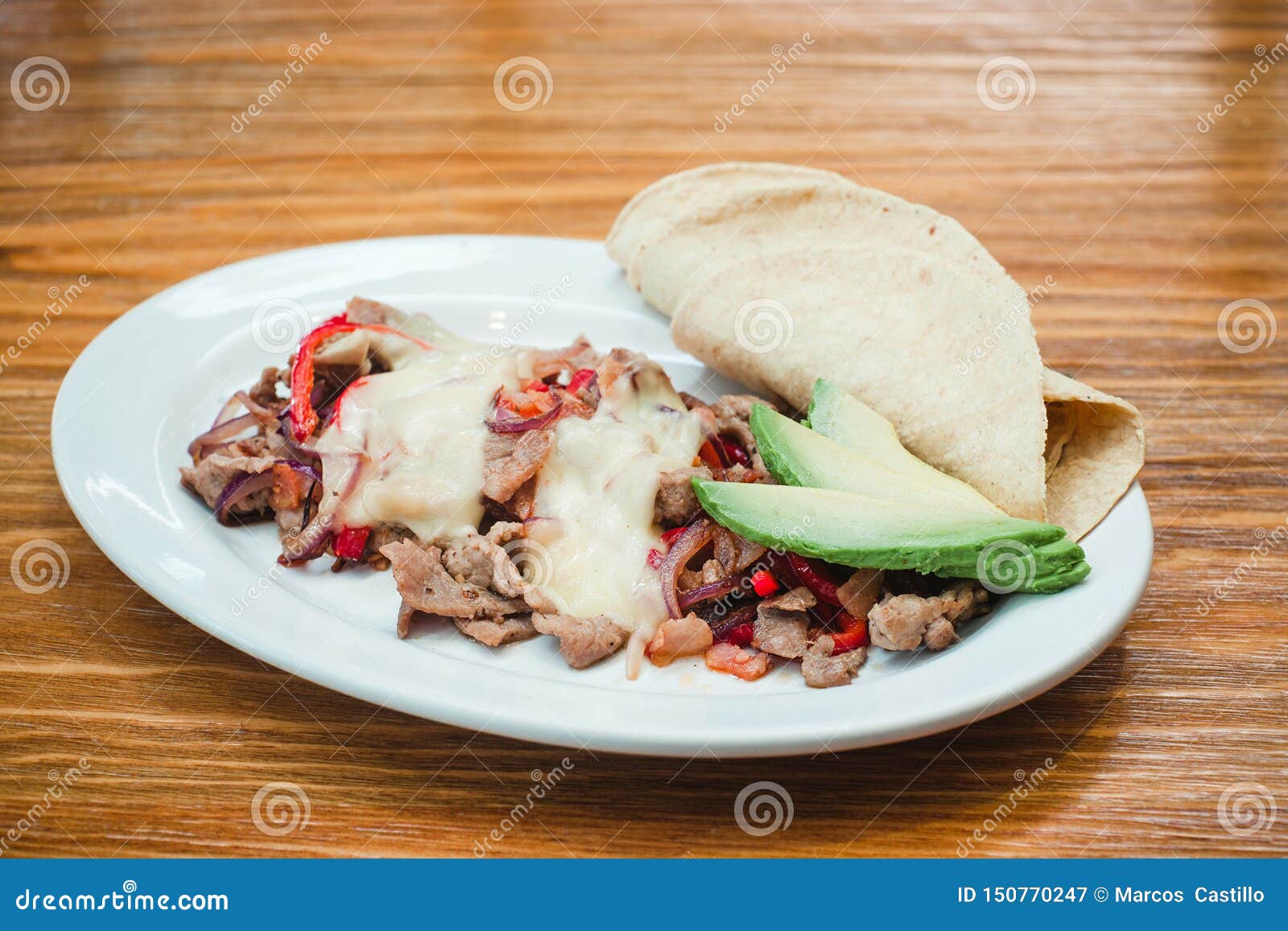 mexican food, alambre is made with beef, onion, bacon, chili, cheese and tortillas in mexico