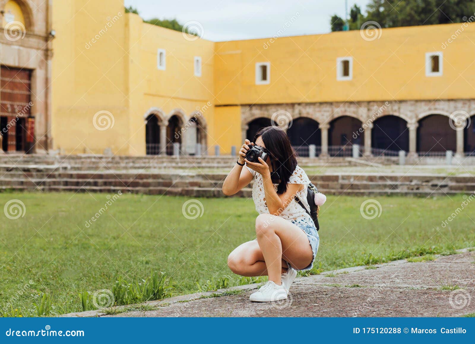 mexican girl with camara, female photographer taking pictures on south america in vacations