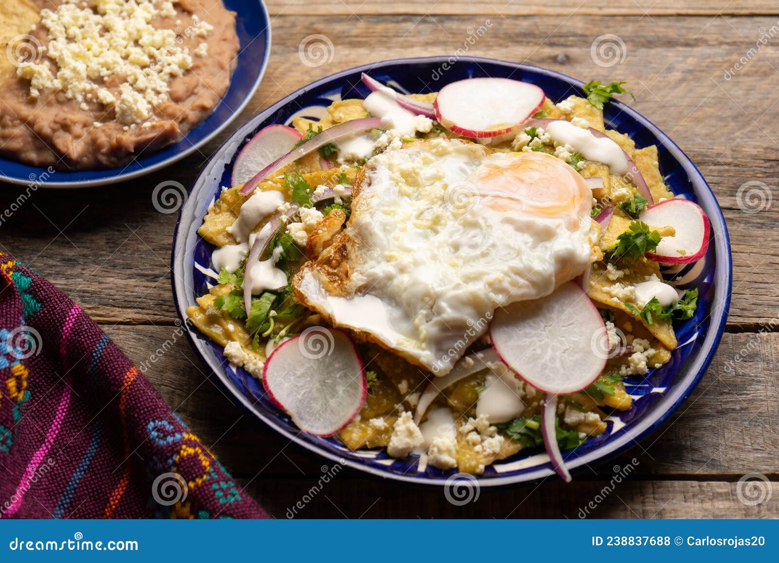 Mexican Green Chilaquiles with Fried Egg and Cheese Stock Photo Image