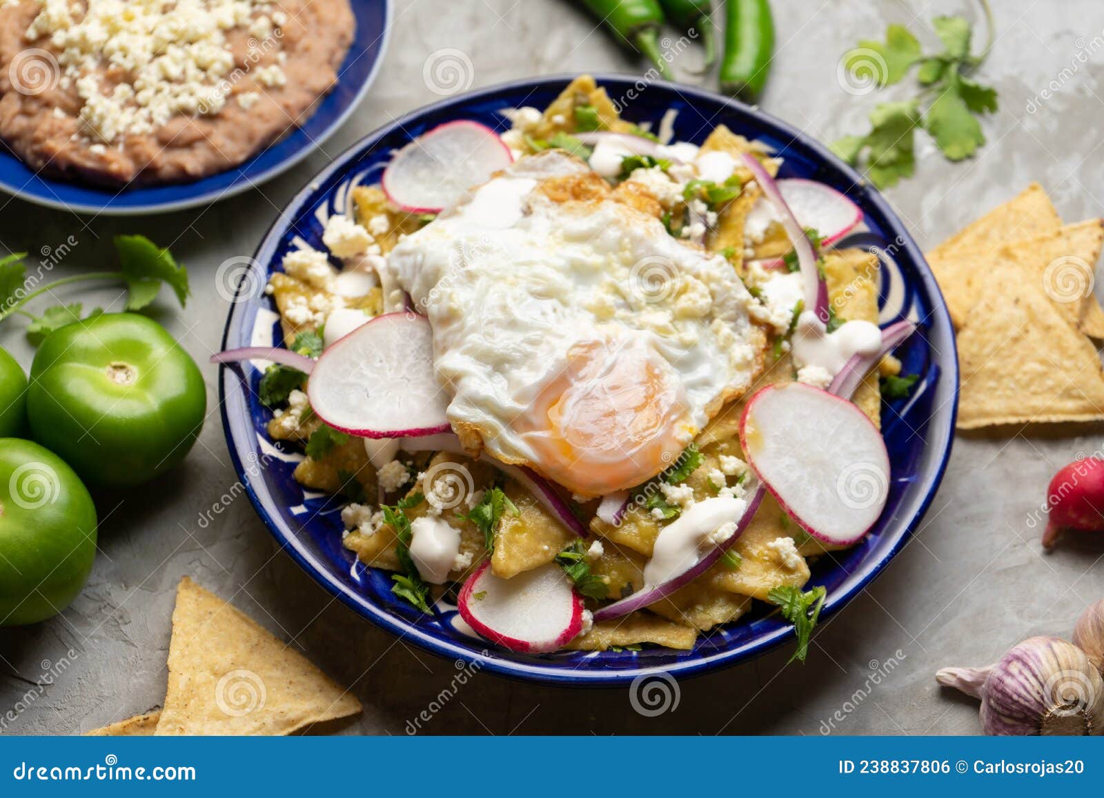 Mexican Green Chilaquiles with Fried Egg and Cheese Stock Photo Image
