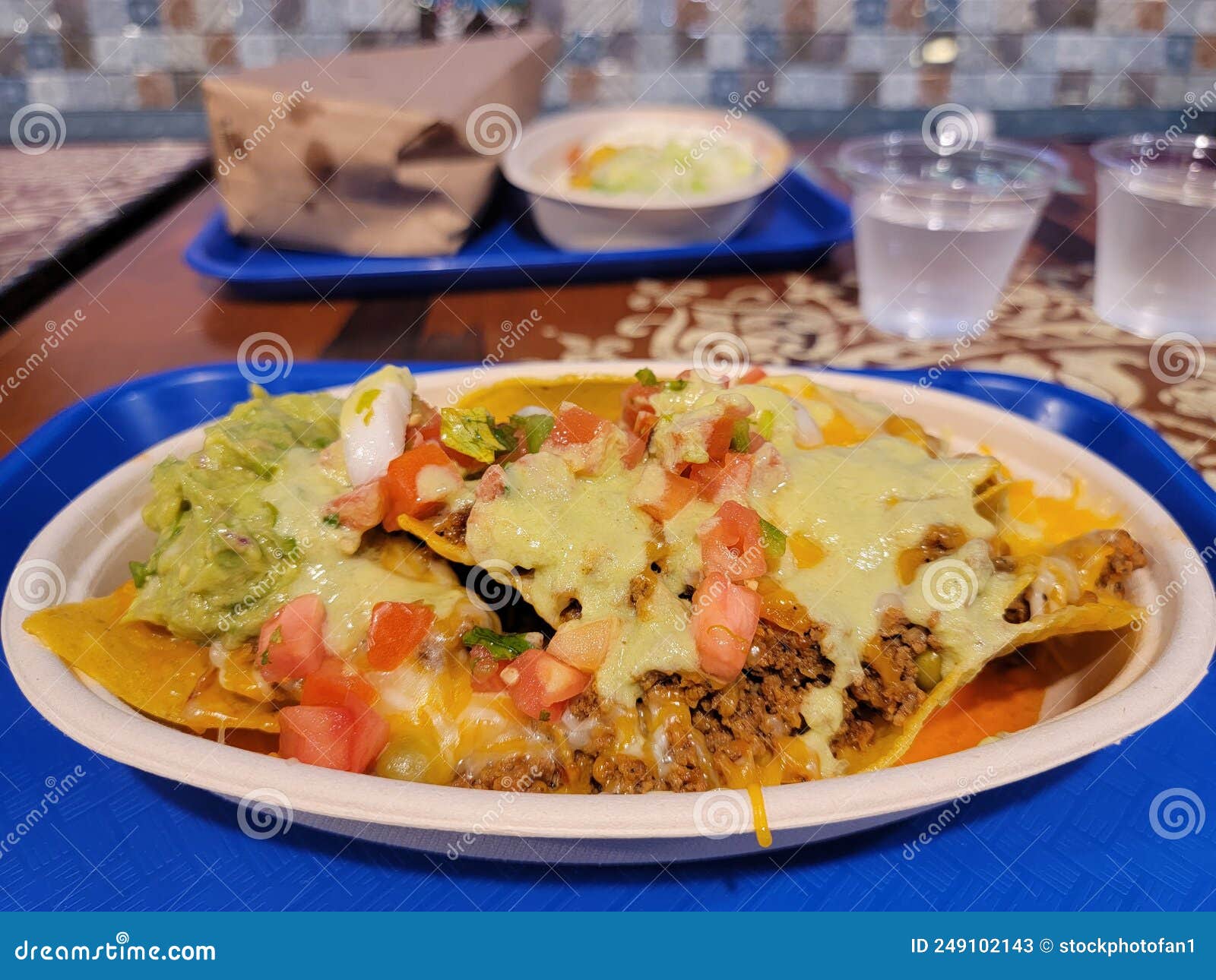 Mexican Nachos on Plate with Avocado and Salsa and Cheese Stock Image Image of water