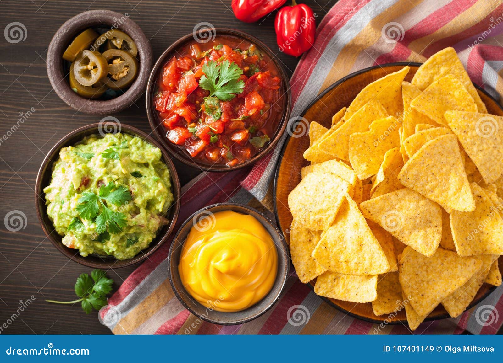 mexican nachos tortilla chips with guacamole, salsa and cheese d