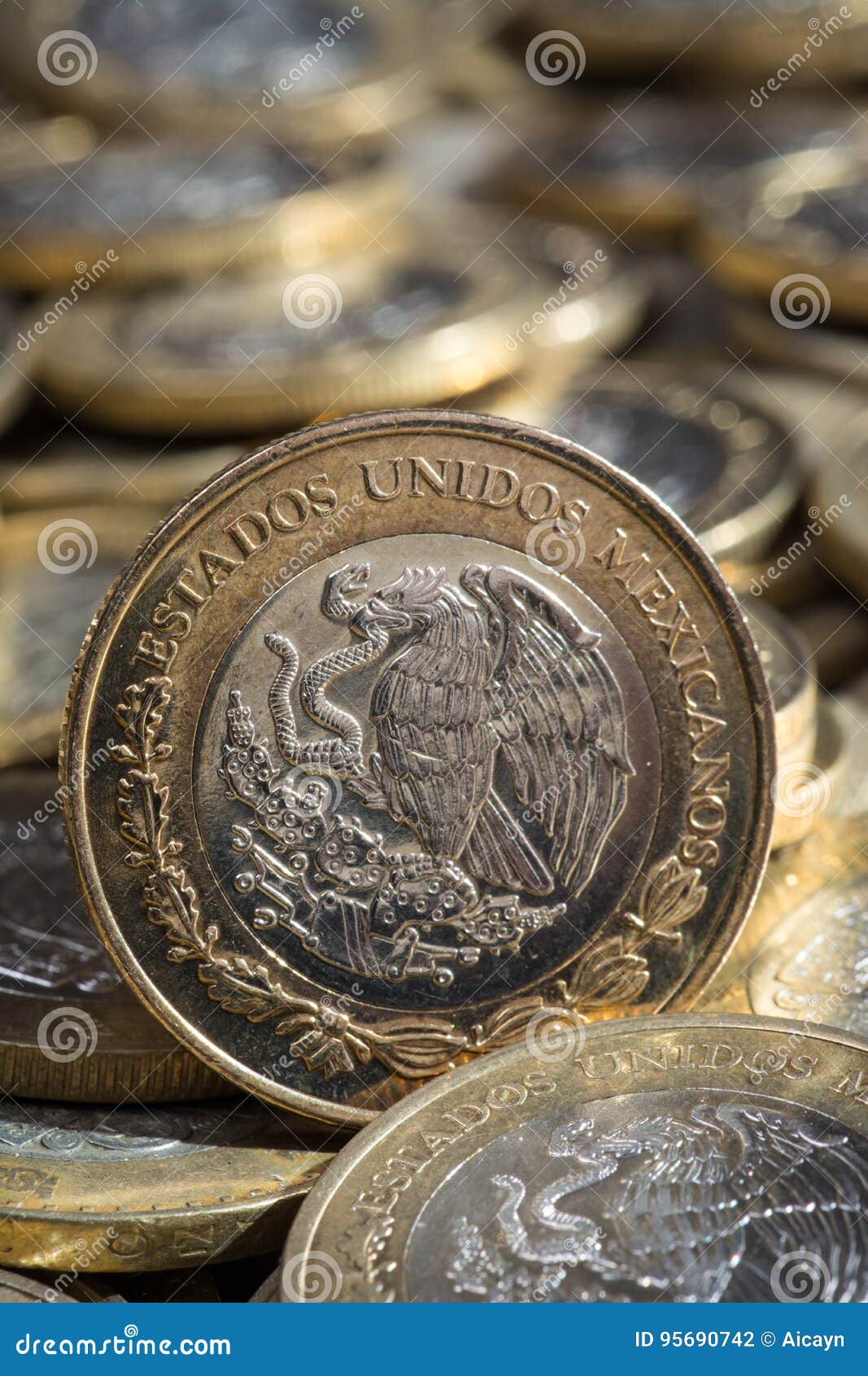 mexican pesos currency on more coins in disorder, vertical