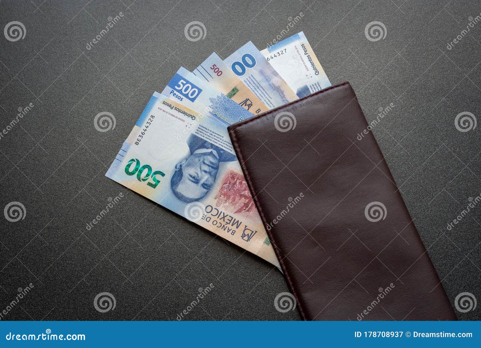 mexican 500 pesos pile of blue bucks inside a wallet background medium