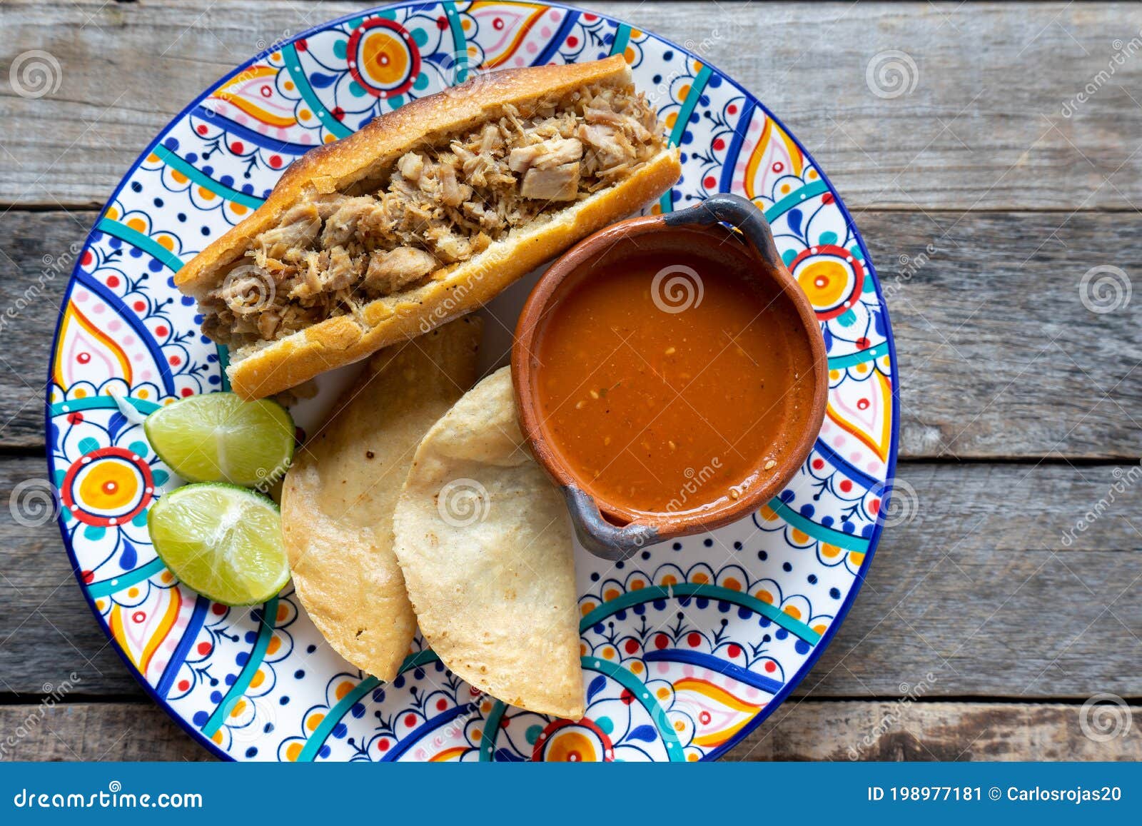 mexican pork sandwich with red sauce also called torta ahogada