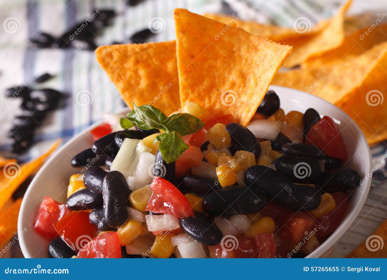 Mexican Salsa with Black Beans and Corn Chips Nachos Macro. Hori Stock