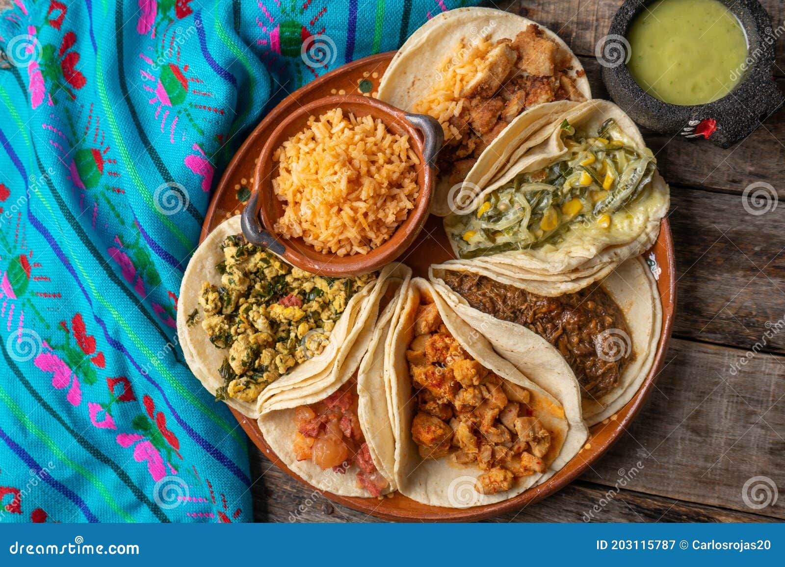 https://thumbs.dreamstime.com/z/mexican-stew-tacos-also-called-guisados-rice-wooden-background-traditional-203115787.jpg