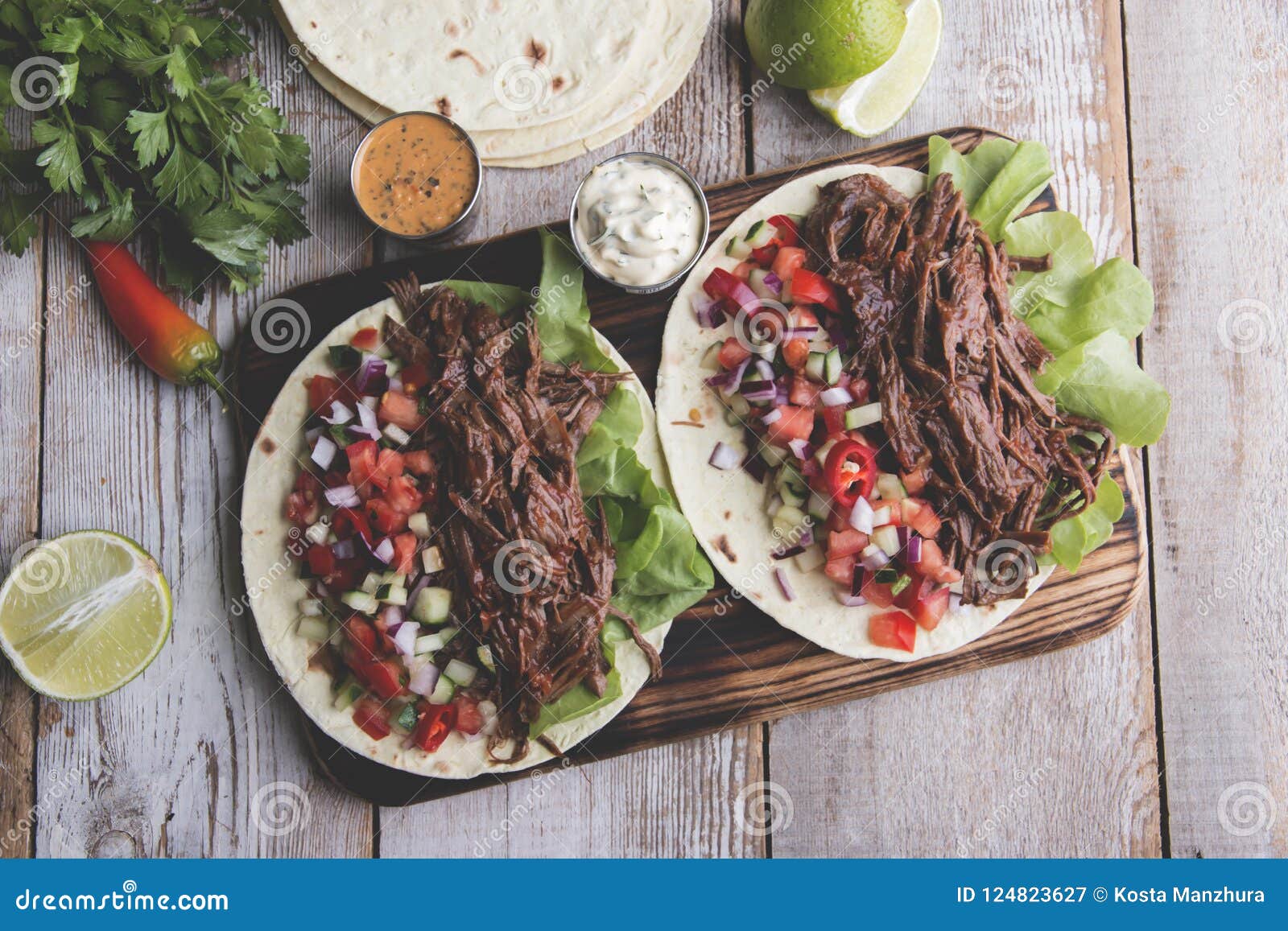 Mexican Tacos with Roasted Beef ,sauce and Salsa Tomato Stock Image
