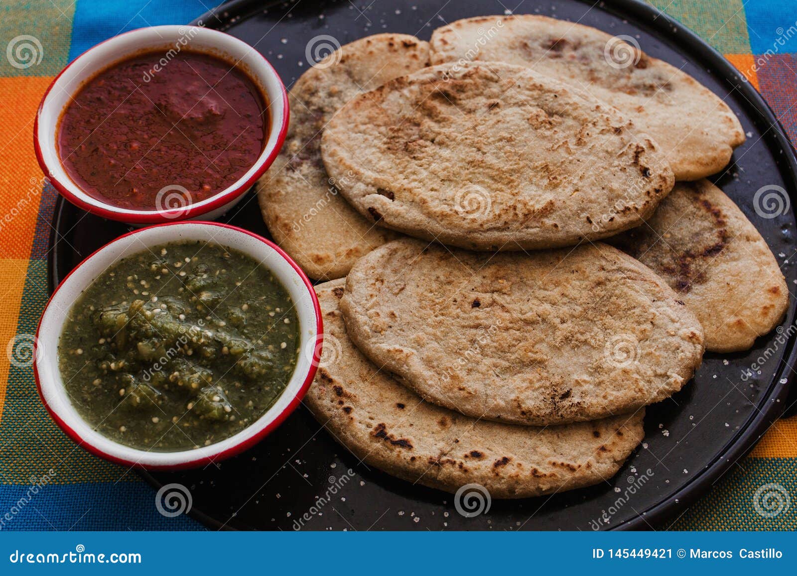 mexican tlacoyos with green and red sauce, traditional food in mexico