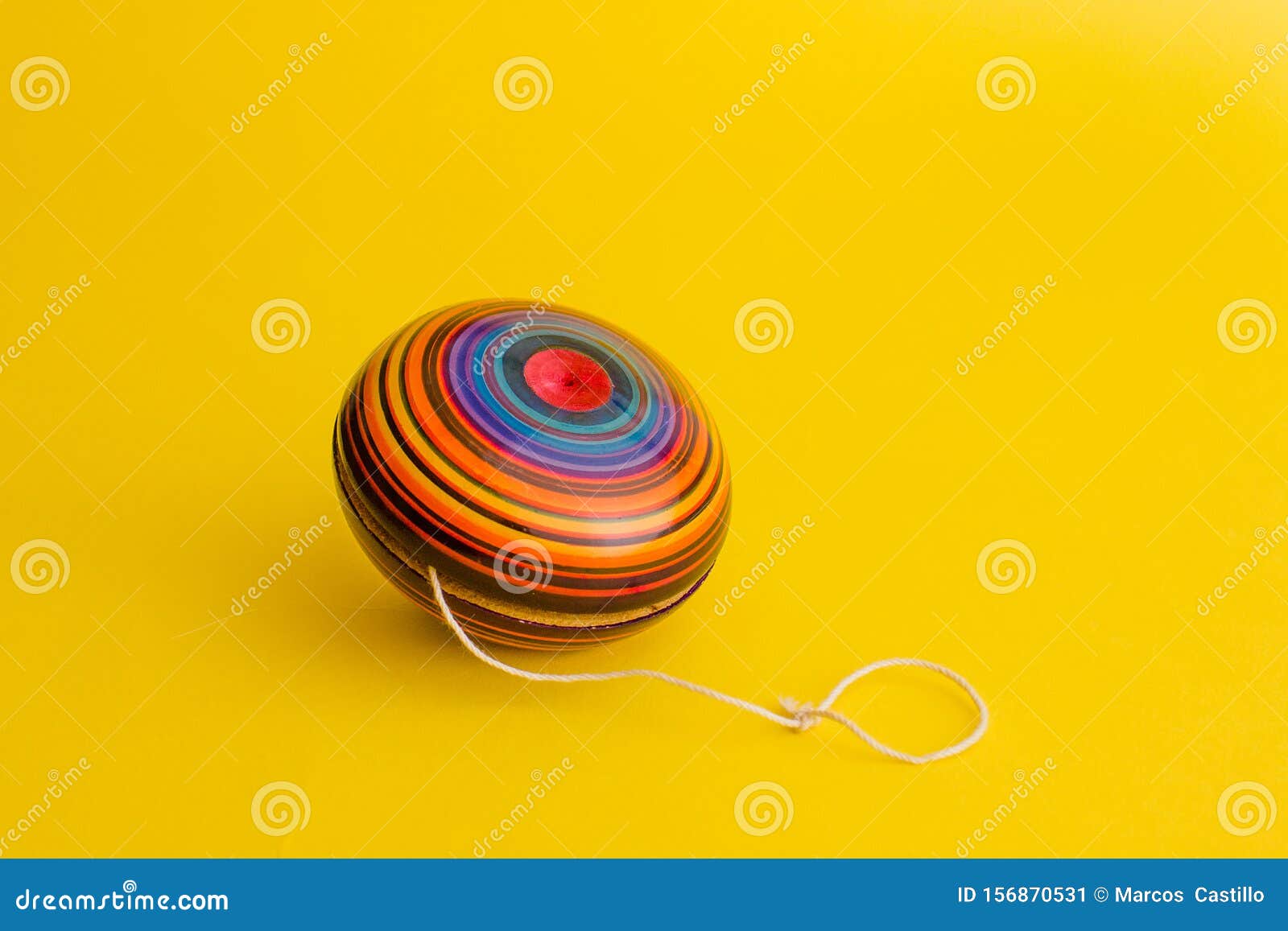mexican toys, yoyo from wooden in mexico on yellow background