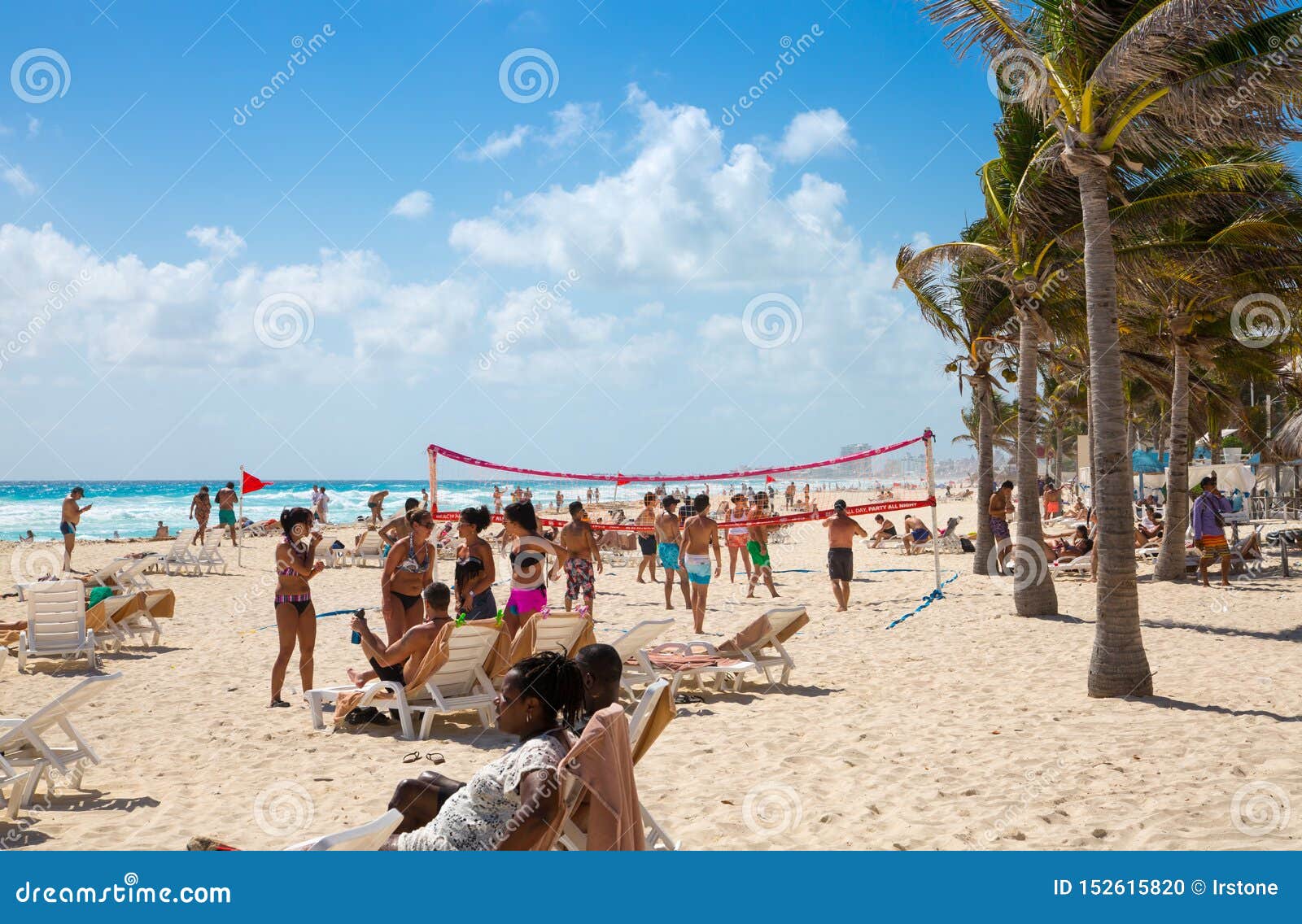 Mexico, Cancun. Group of Young People Relaxing, Playing and 