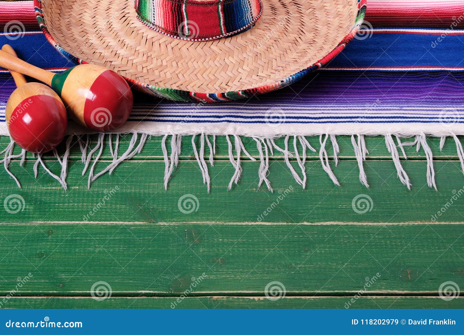 mexico mexican sombrero maracas fiesta wood background border top edge