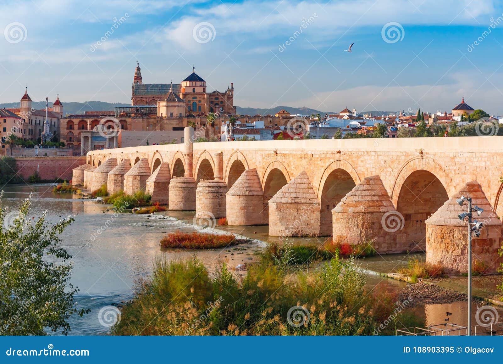 mezquita and roman bridge in cordoba, spain