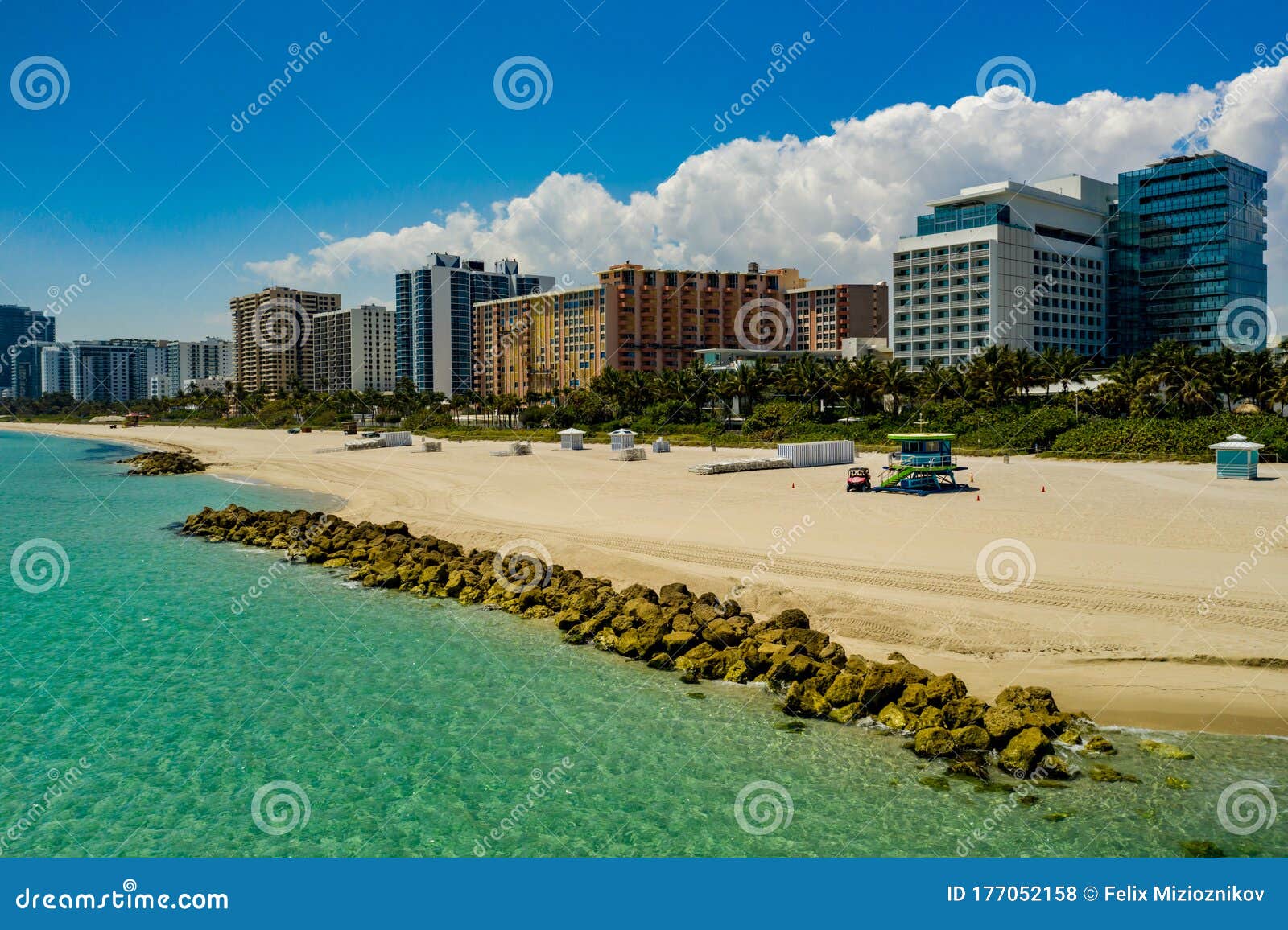 Miami Beach Coastal Scene with Rocks and Condominiums Stock Photo