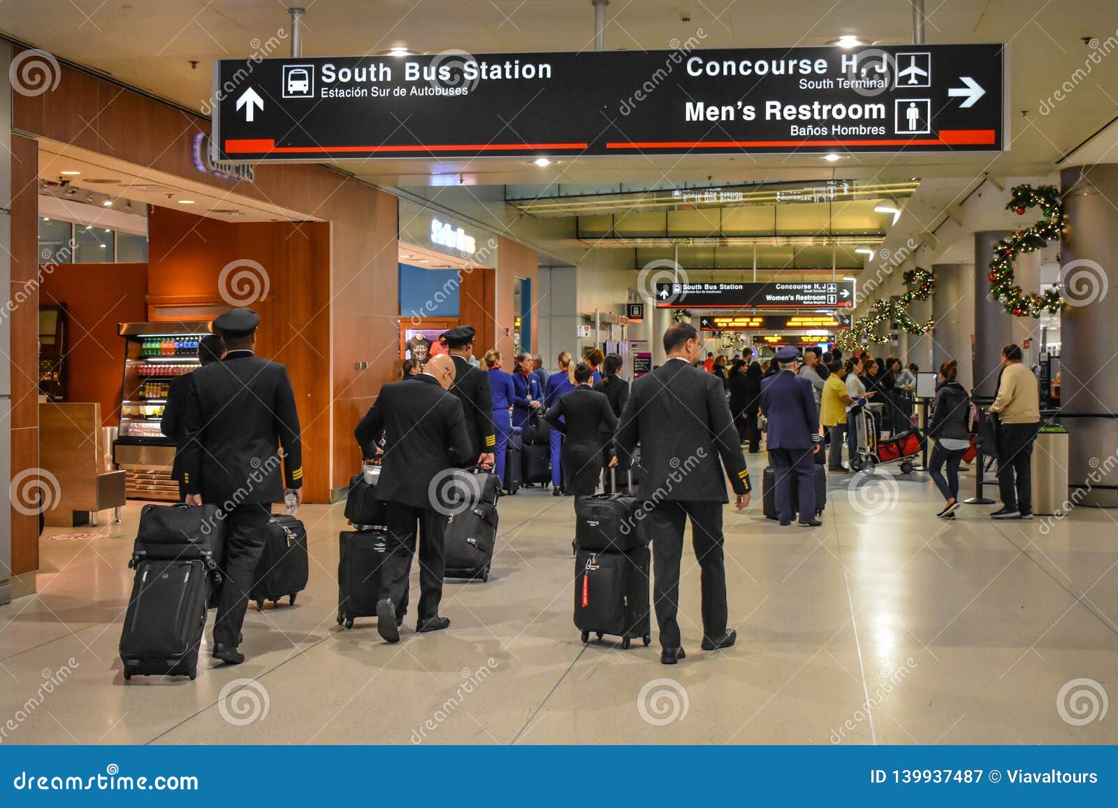 airline crew walking in terminal h at miami international