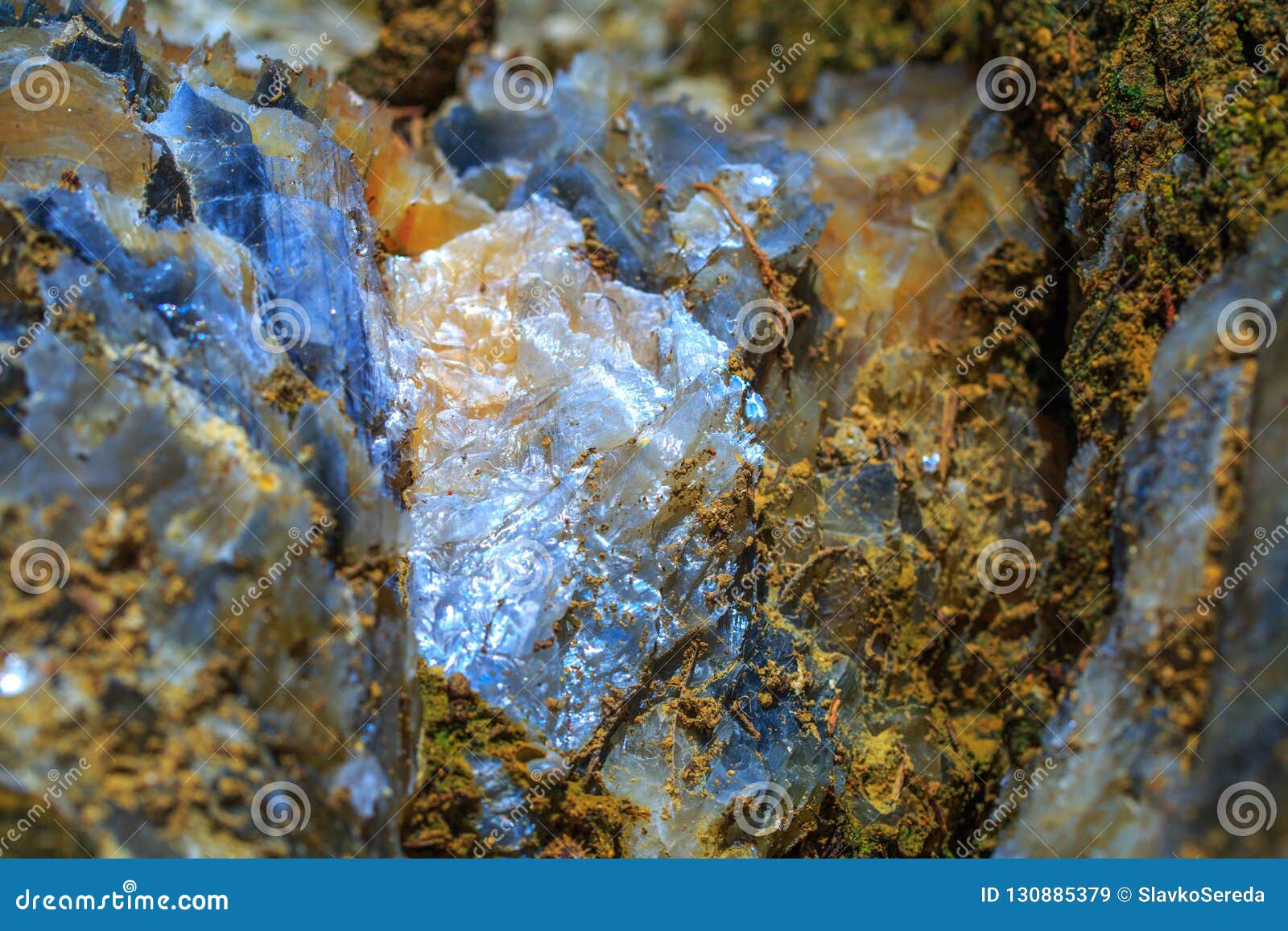 the mica sheets and quartz silicate minerals. bare geological rock in soft sludge clay rocks. macro lens shot.