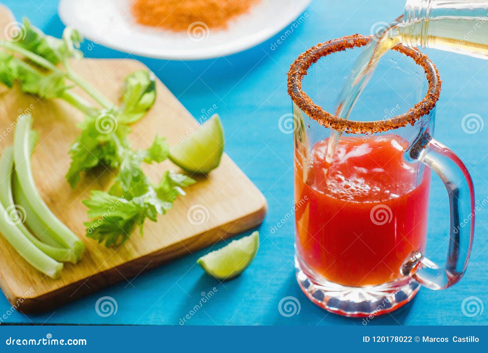 michelada is beer with tomato juice, spicy sauce and lemon, mexican drink cocktail in mexico