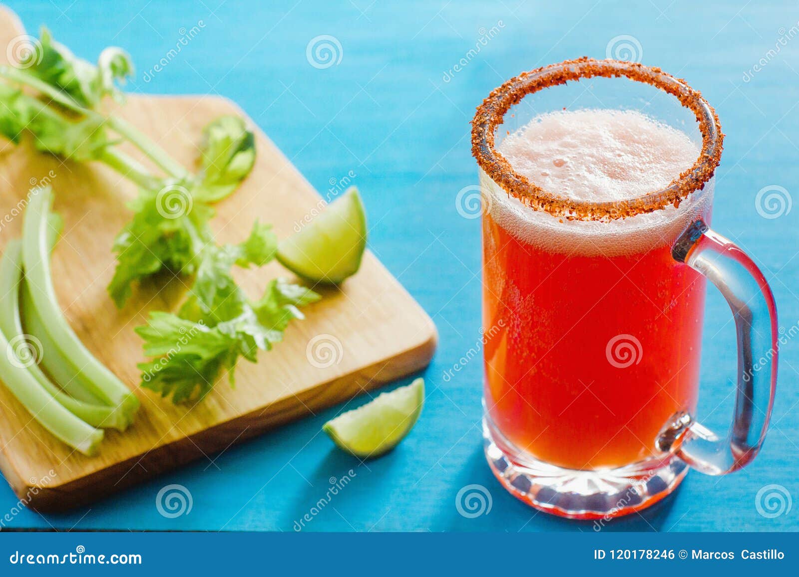 michelada beer with tomato juice, spicy sauce and lemon, mexican drink cocktail in mexico