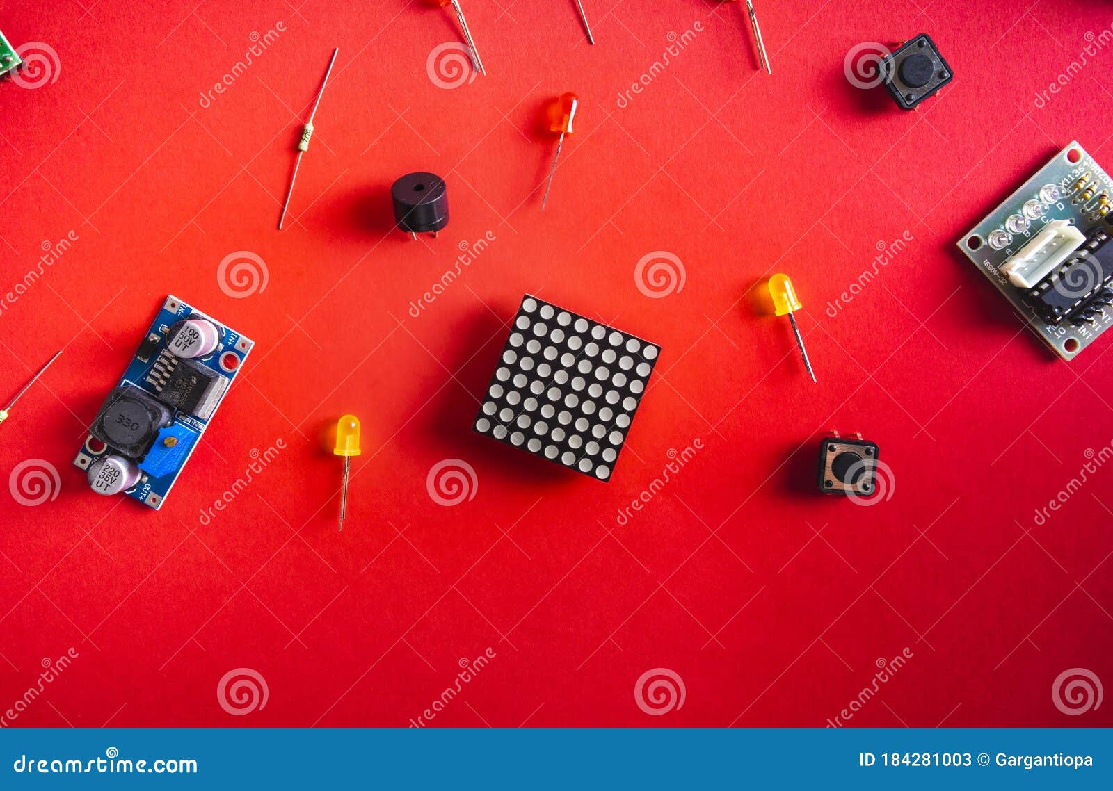 Micro Electronics Arduino DIY Components Over Red Background, Top View