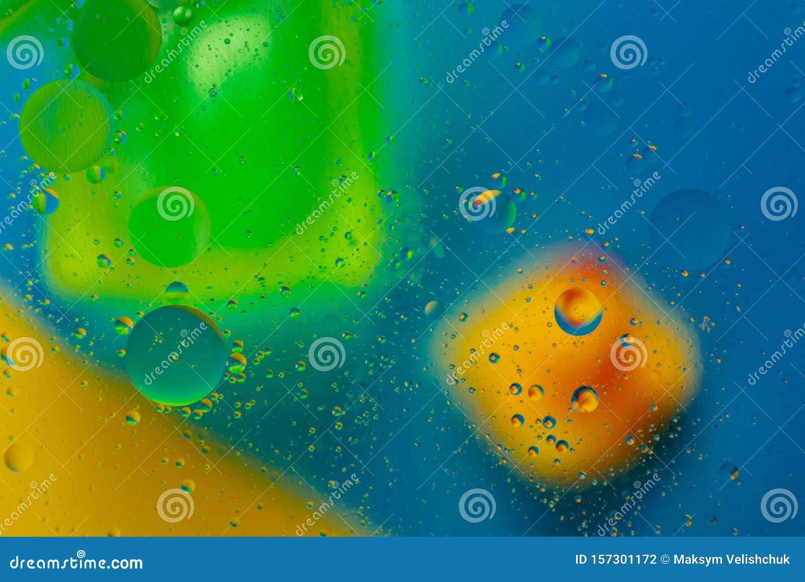 Micro Molecular Abstract Pattern of Colored Oil Bubbles on Water. Stock