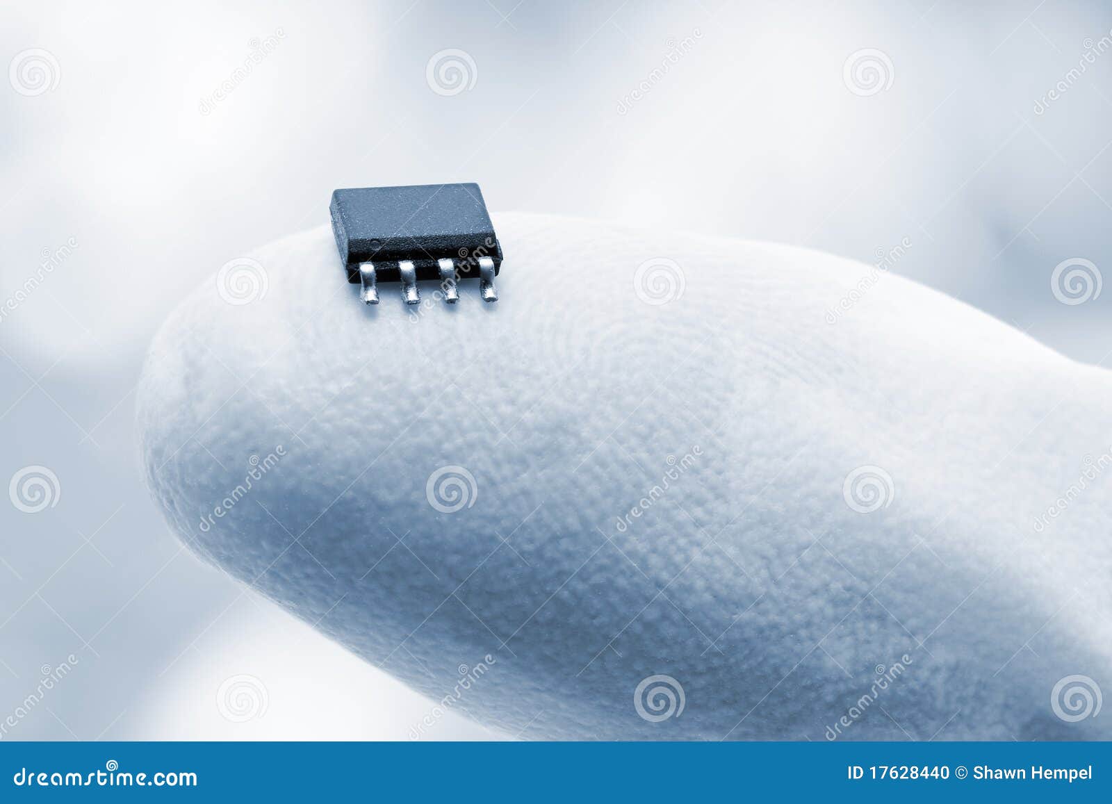 microchip on a fingertip