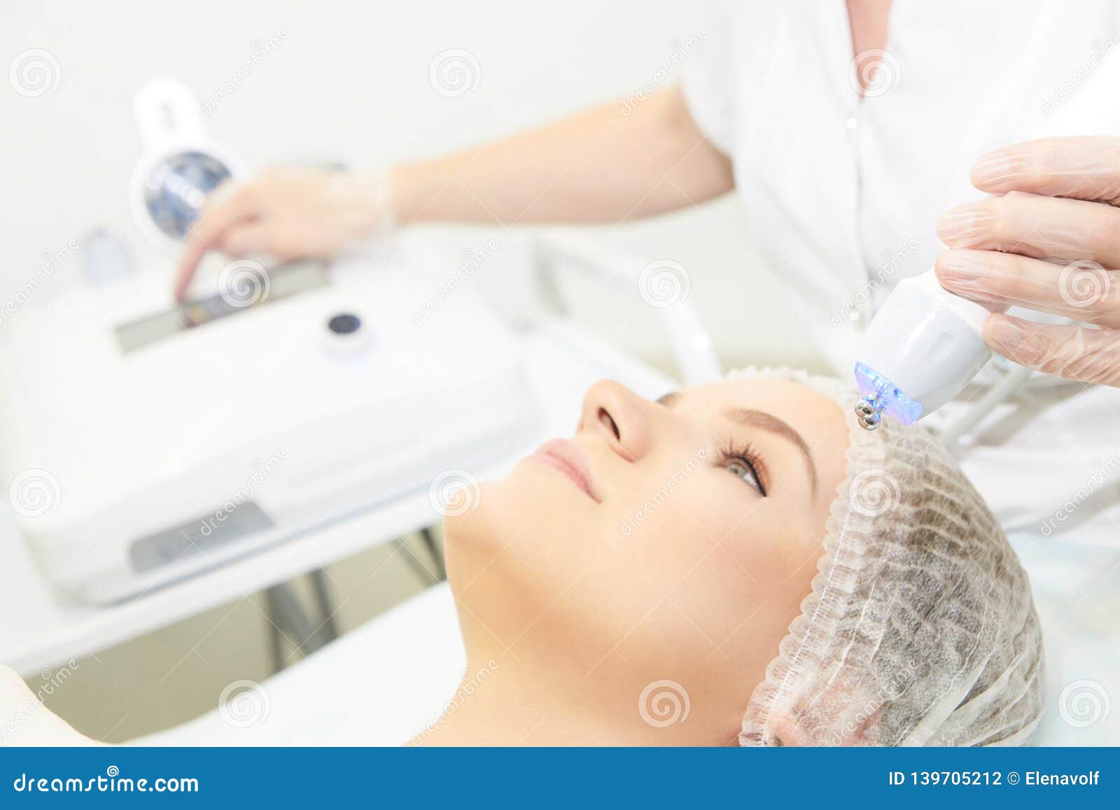 microcurrent facial dermatology procedure. model. aesthetic radiofrequency treatment. micro current cosmetology massage
