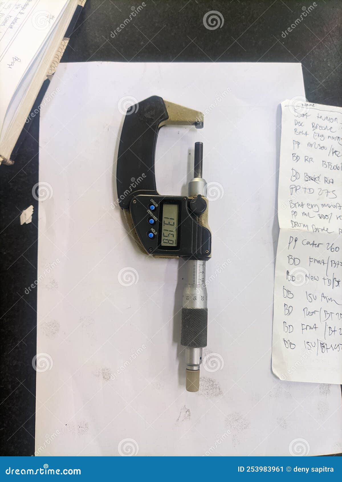 Micrometer on paper stock image. Image of instrument 253983961