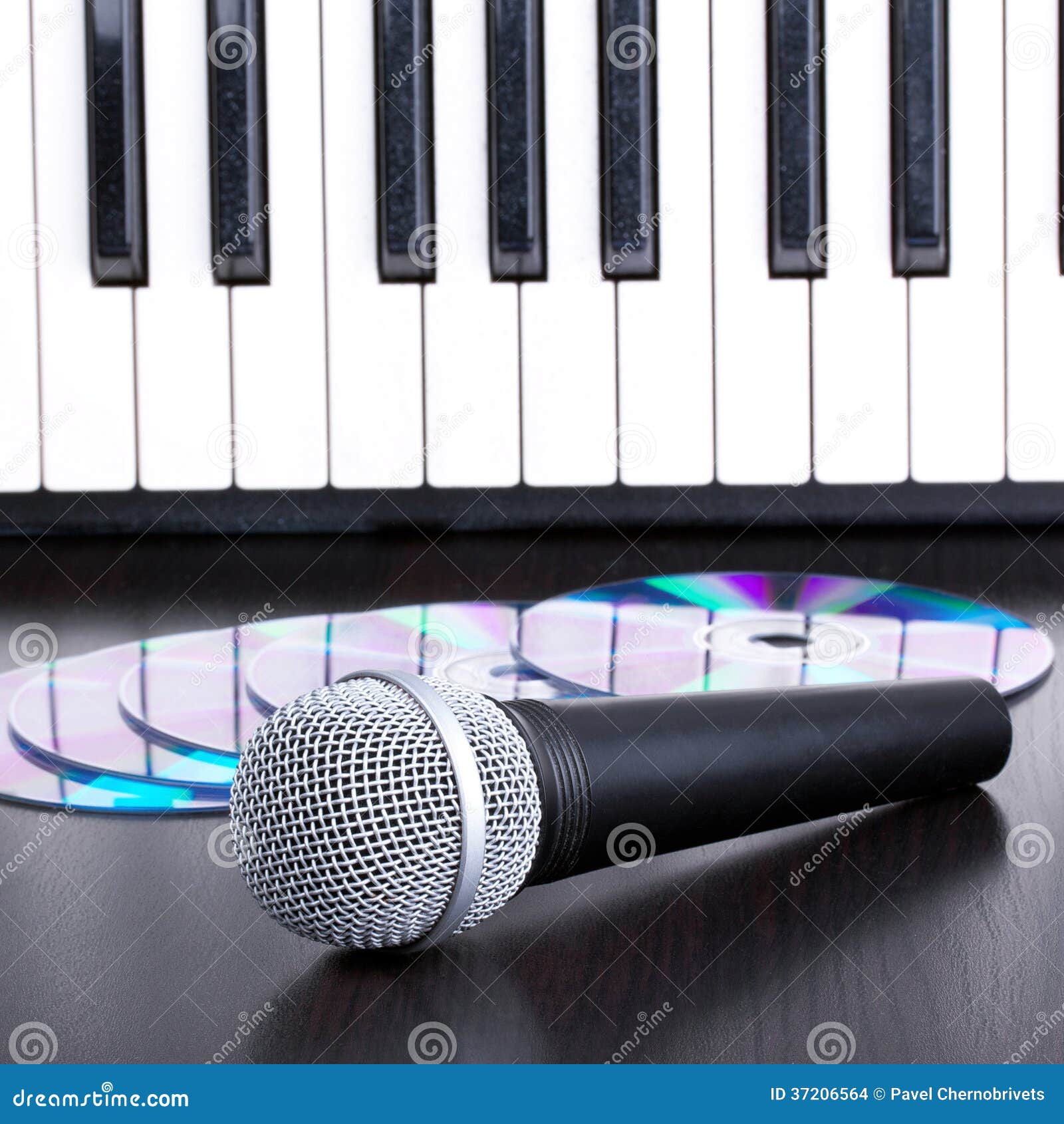 Microphone, Cd and Piano Keyboard on Black Table Stock Photo - Image of