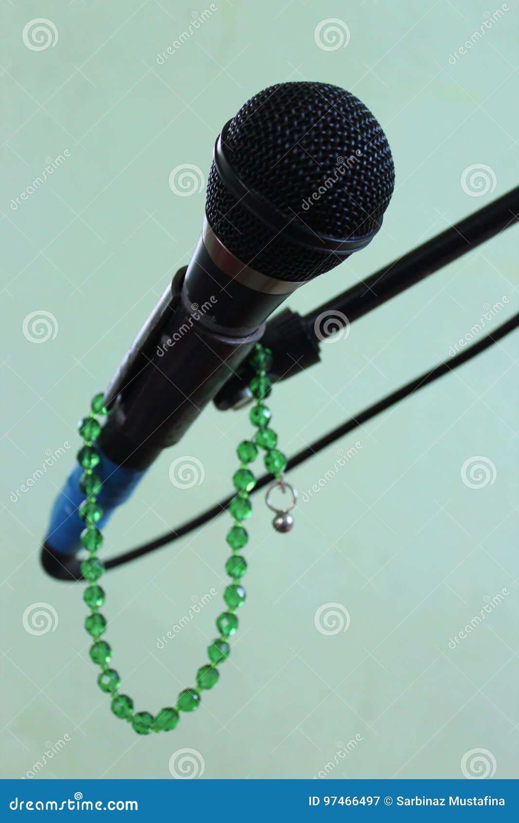 Microphone on a Green Background and Rosary Stock Image Image of