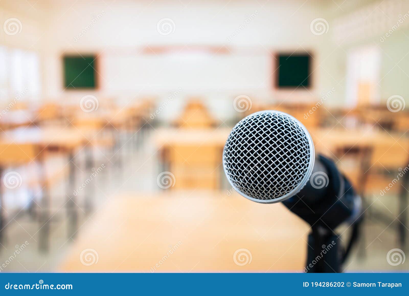 microphones on voice speaker in classroom at university lecture hall, concept of speech and teaching with microphone keynote at