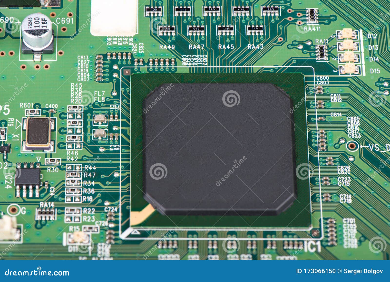 A Microprocessor Soldered into a Green Motherboard Stock Photo Image