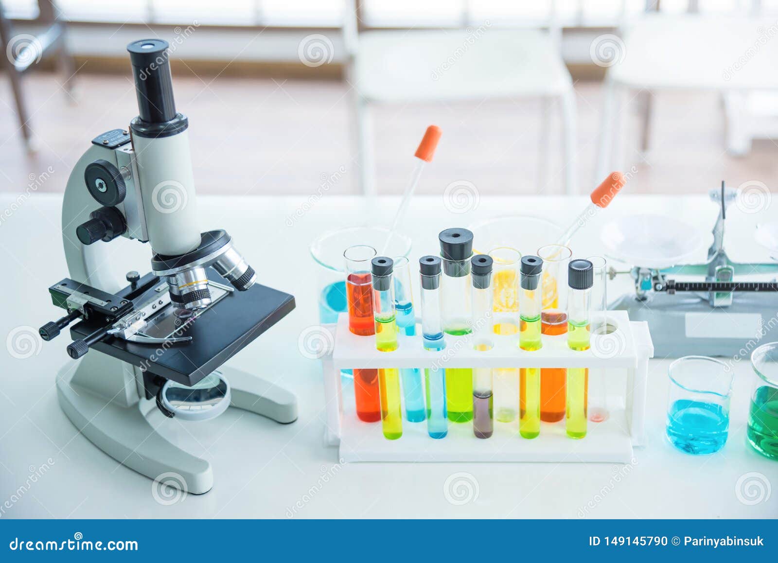 Microscope with Many Test Tubes in the Laboratory Stock Photo Image
