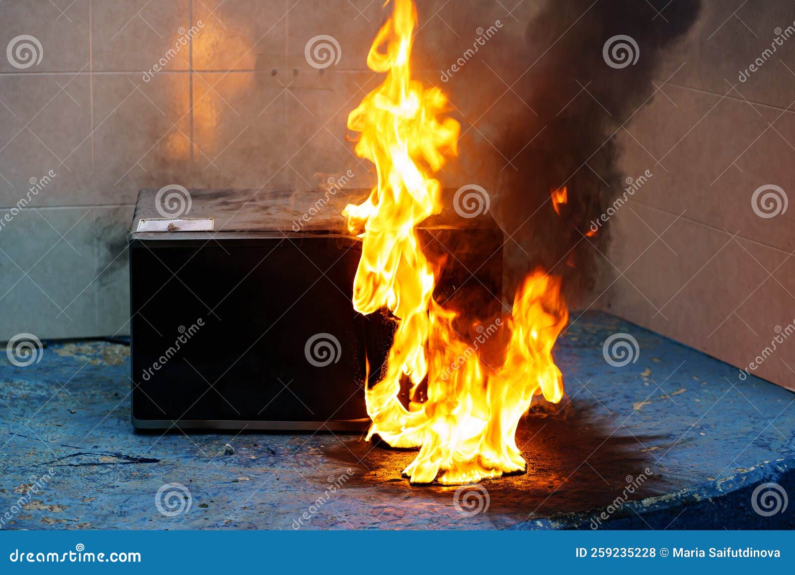 Microwave Oven on Fire. the Concept of Fire in the Kitchen. Stock