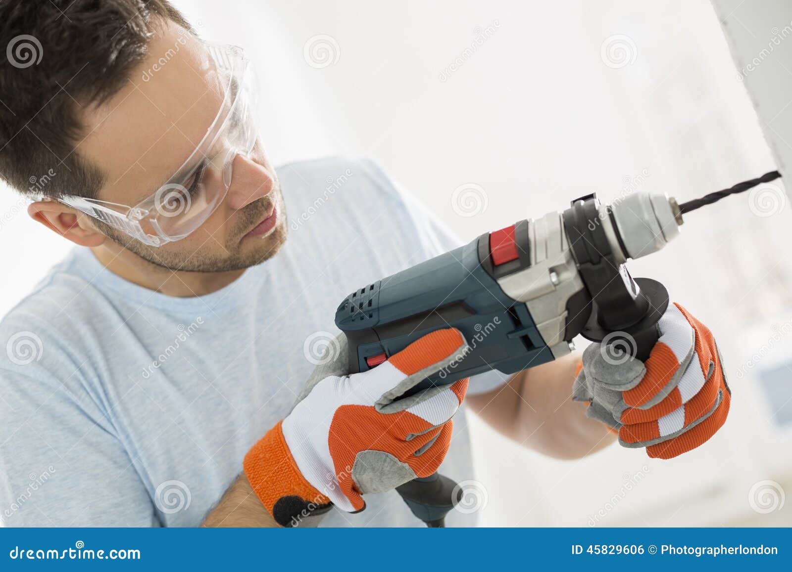 Midadult Man Drilling in Wall Stock Photo Image of drilling, home