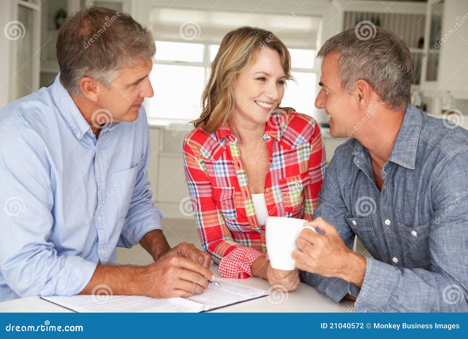 Mid Age Couple with Financial Advisor at Home Stock Photo Image of