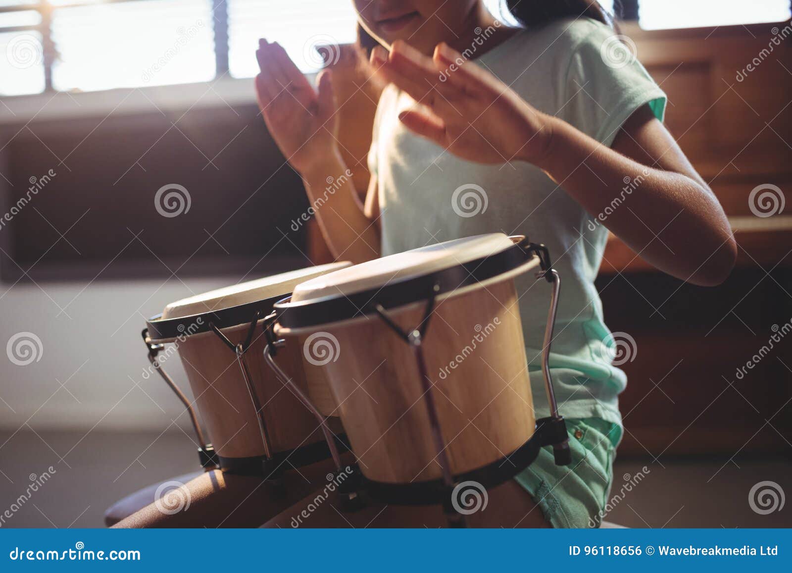 Mid Section of Girl Playing Bongo Drums Stock Photo Image of