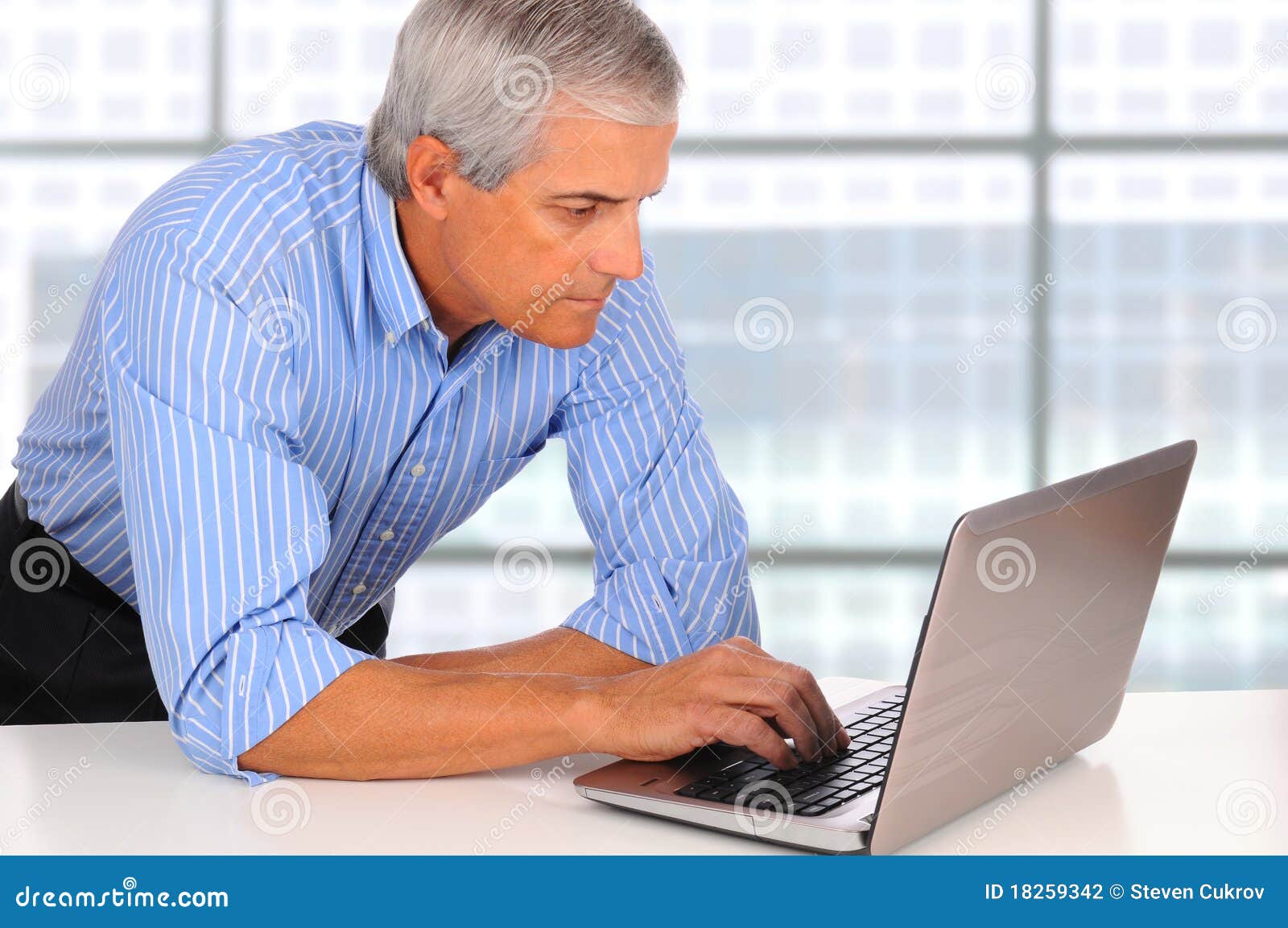 Middle Age Businessman Leaning on Desk with Laptop Stock Photo Image of laptop, handsome 18259342