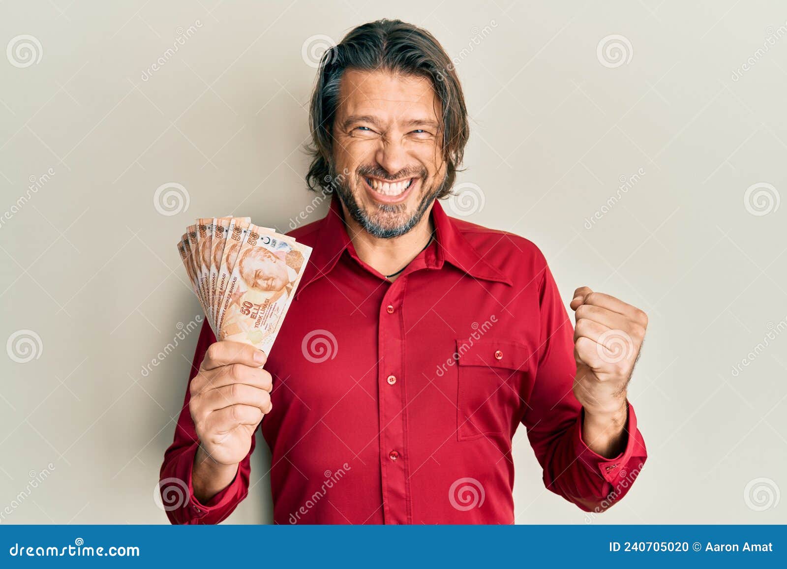 Middle Age Handsome Man Holding 50 Turkish Lira Banknotes Screaming Proud Celebrating Victory