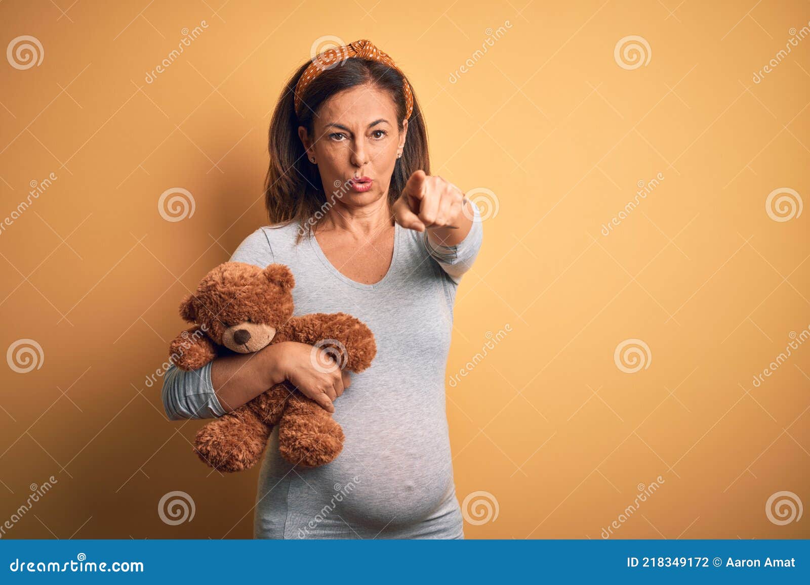 Middle Age Pregnant Woman Expecting Baby Holding Teddy Bear Stuffed Animal  Pointing with Finger To the Camera and To You, Hand Stock Photo - Image of  stuffed, expecting: 218349172