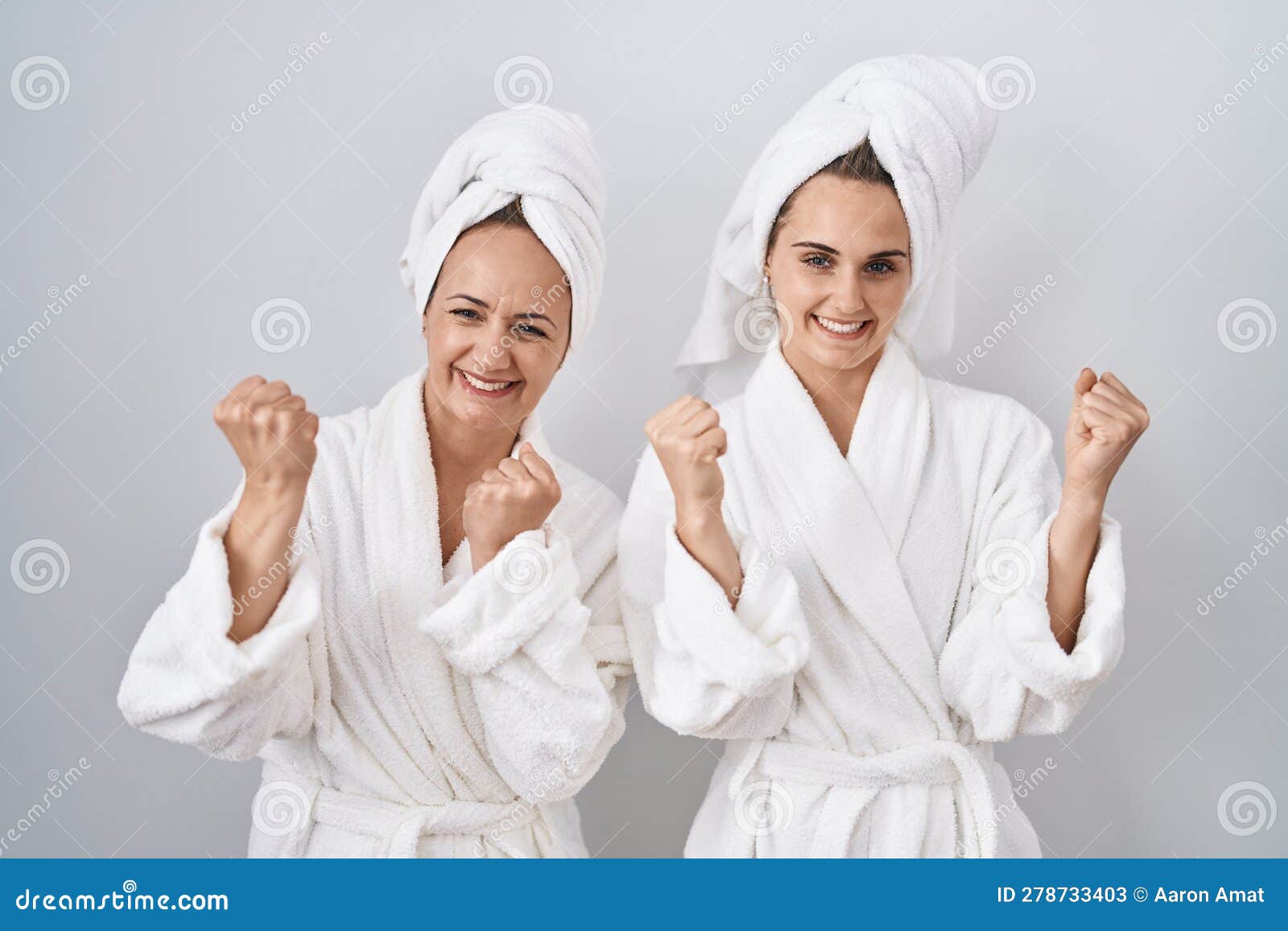 Middle Age Woman and Daughter Wearing White Bathrobe and Towel Very