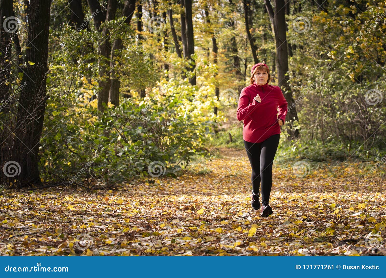 Middle Age Woman Wearing Sportswear and Running in Forest Stock Image ...