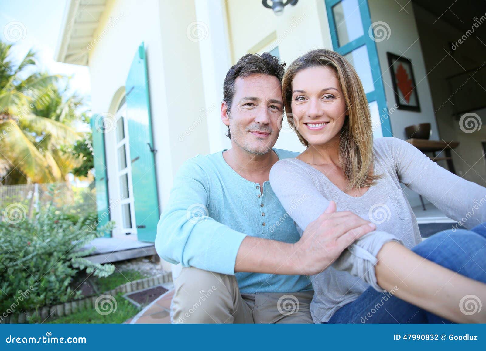 middle-aged couple sitting in the garden