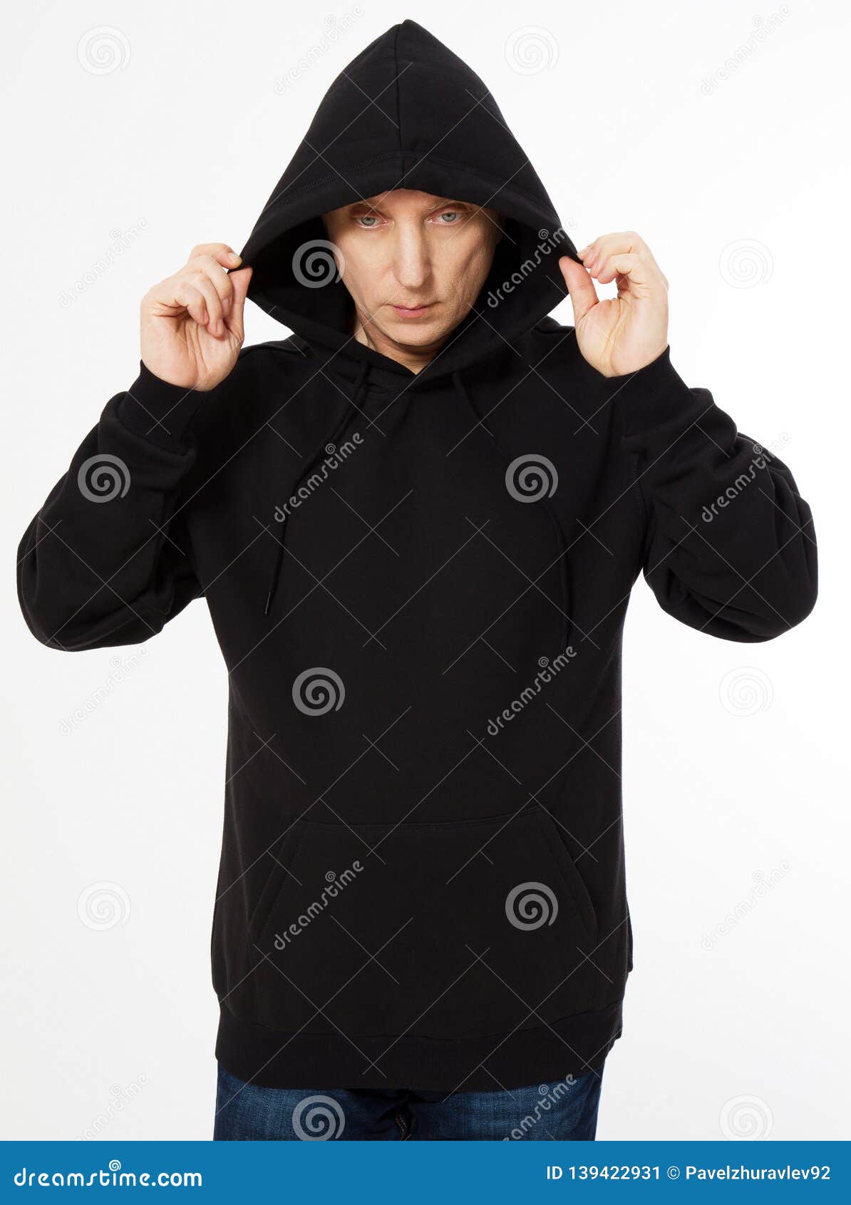 Download Middle-aged Man In A Black Hooded Sweatshirt Looks Down ...