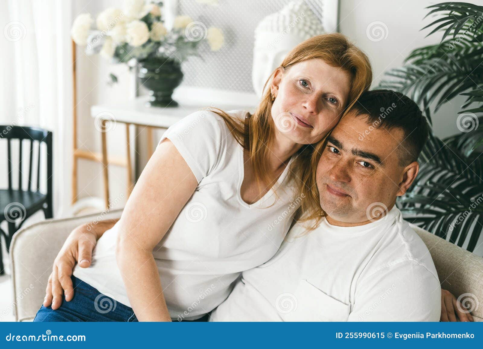 Middle Aged Married Couple Hugging On The Couch Stock Image Image Of Apartment Love 255990615