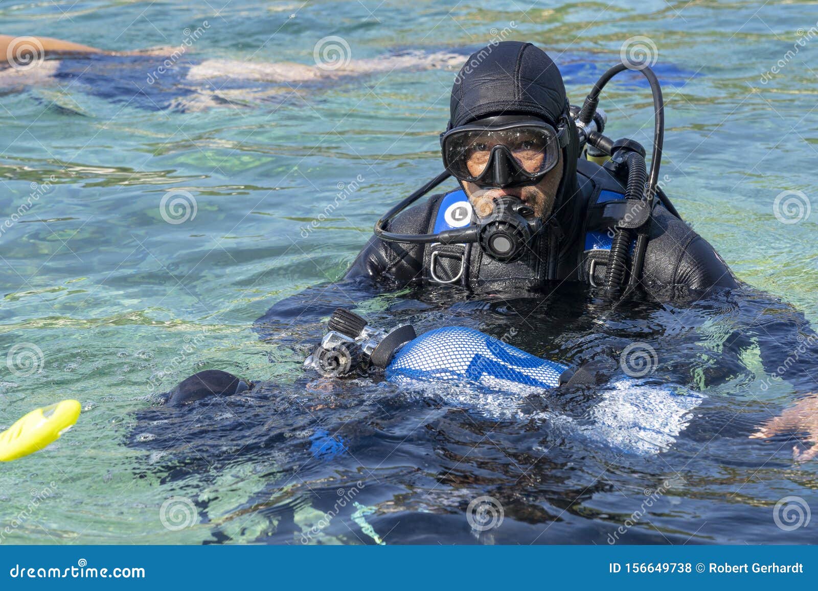 Middle Aged Scuba Diving Instructor Teaching Diving Students Stock