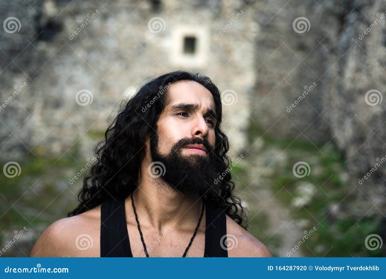 Middle-aged Man with Long Hairstyle. Sad Frustrated Man with Long Dark Wavy  Hair and Beard Looking Far Away Stock Photo - Image of people, masculinity:  164287920