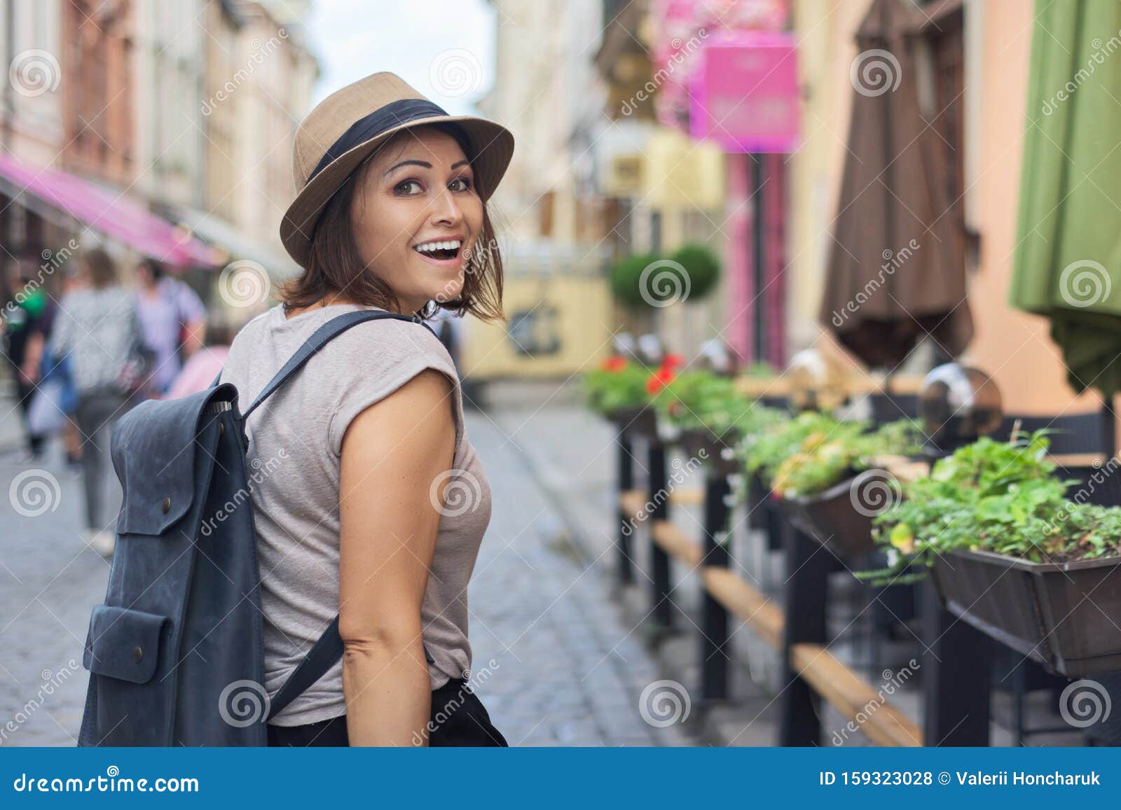 Middle Aged Smiling Woman in Hat Traveling in Tourist City Stock Photo ...